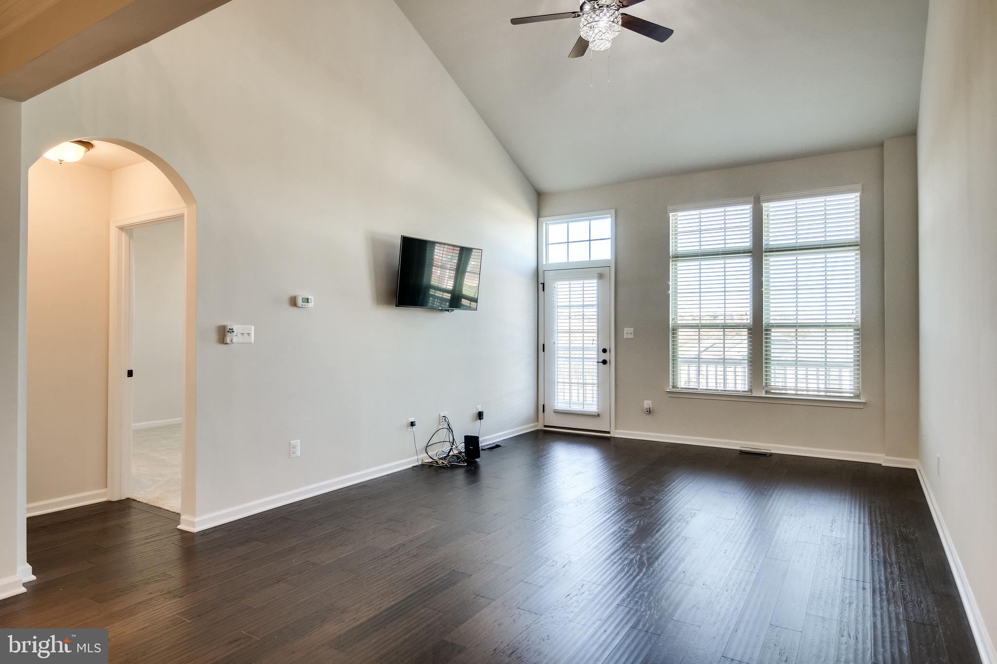 18068 Red Mulberry Road Dumfries, VA 22026 - Photo 10 of 40 Living Room w/wall mounted TV, cathedral ceiling,
