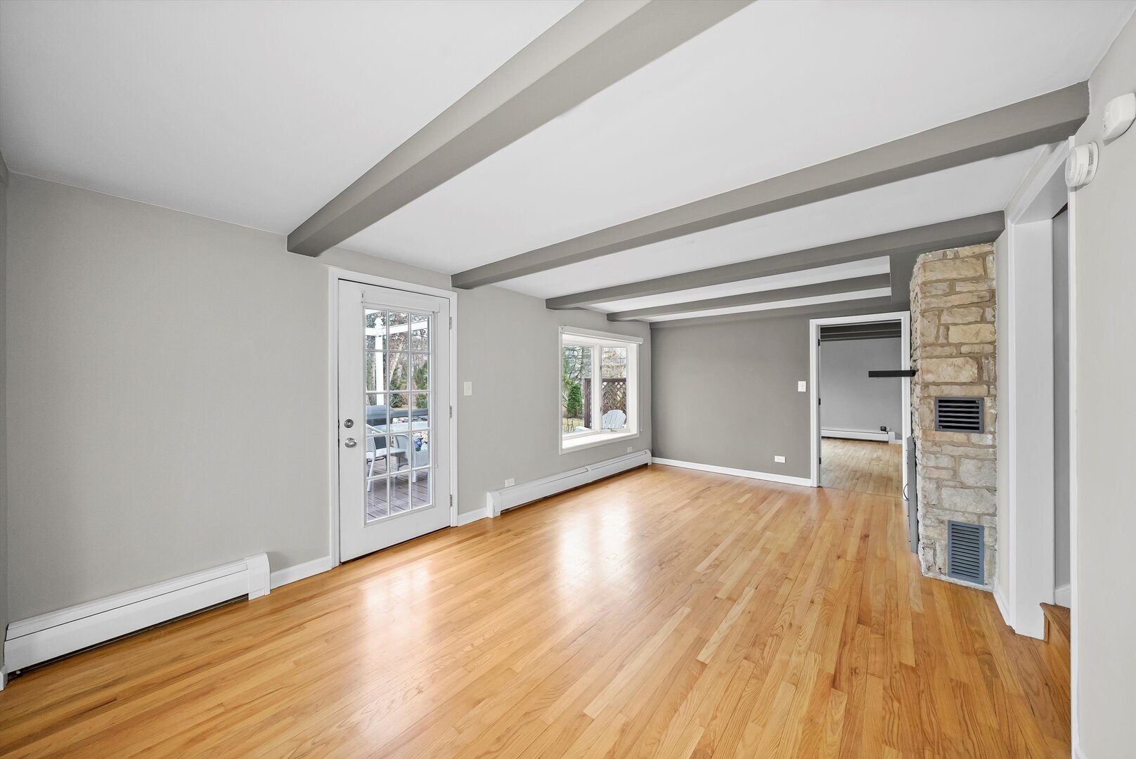 452 Deerpath Road Wood Dale, IL 60191 - Photo 11 of 50 a view of an empty room with wooden floor and a window