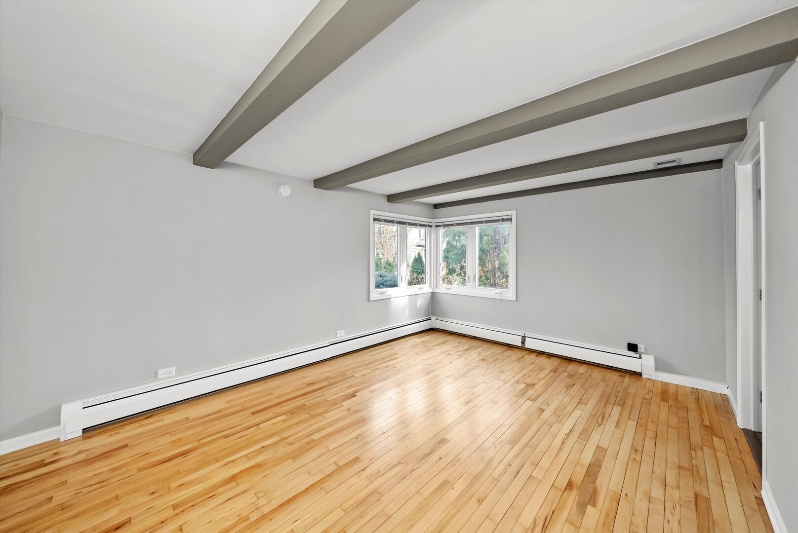 452 Deerpath Road Wood Dale, IL 60191 - Photo 13 of 50 a view of an empty room with wooden floor and a window