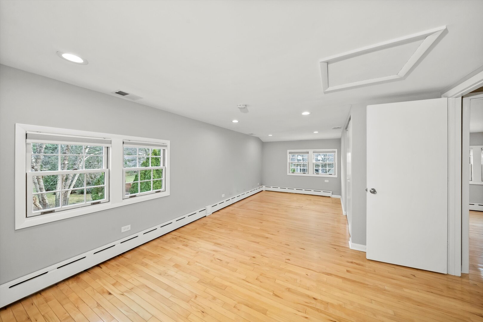 452 Deerpath Road Wood Dale, IL 60191 - Photo 21 of 50 a view of an empty room with wooden floor and a window