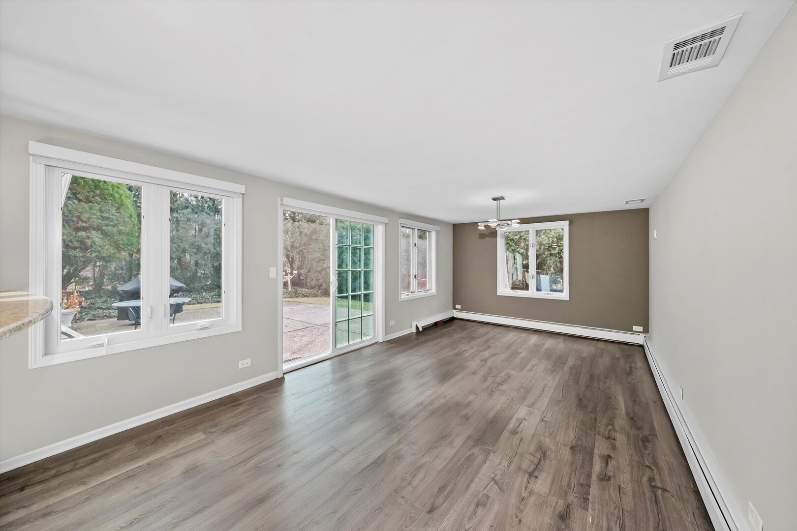 452 Deerpath Road Wood Dale, IL 60191 - Photo 23 of 50 a view of an empty room with wooden floor and a window
