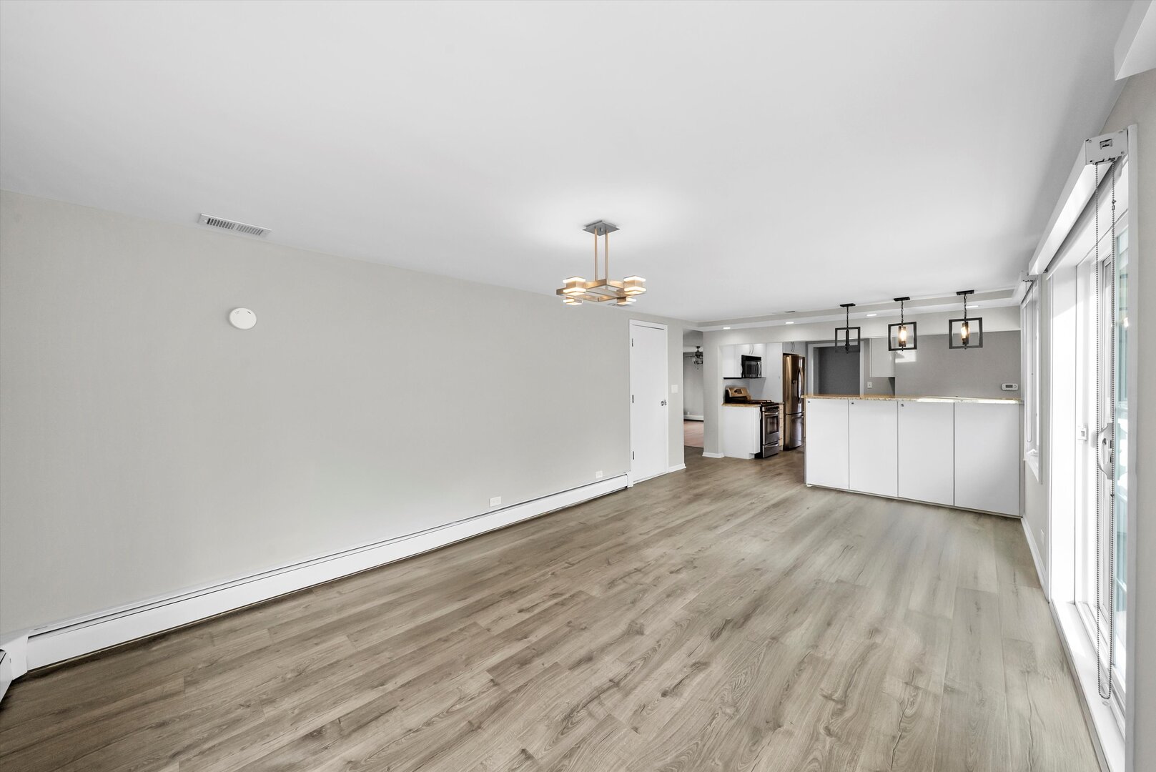 452 Deerpath Road Wood Dale, IL 60191 - Photo 25 of 50 a view of a kitchen with a dishwasher cabinets and wooden floor