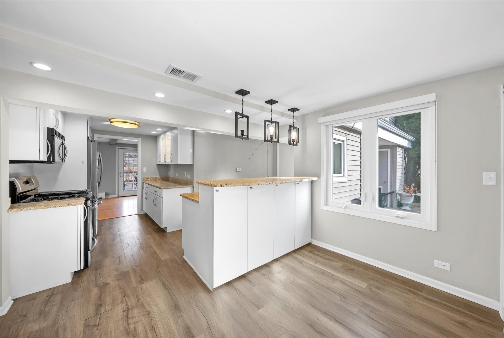 452 Deerpath Road Wood Dale, IL 60191 - Photo 26 of 50 a view of a kitchen with wooden floor