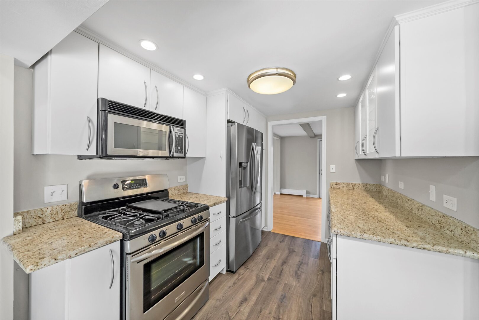 452 Deerpath Road Wood Dale, IL 60191 - Photo 28 of 50 a kitchen with granite countertop a stove top oven and sink