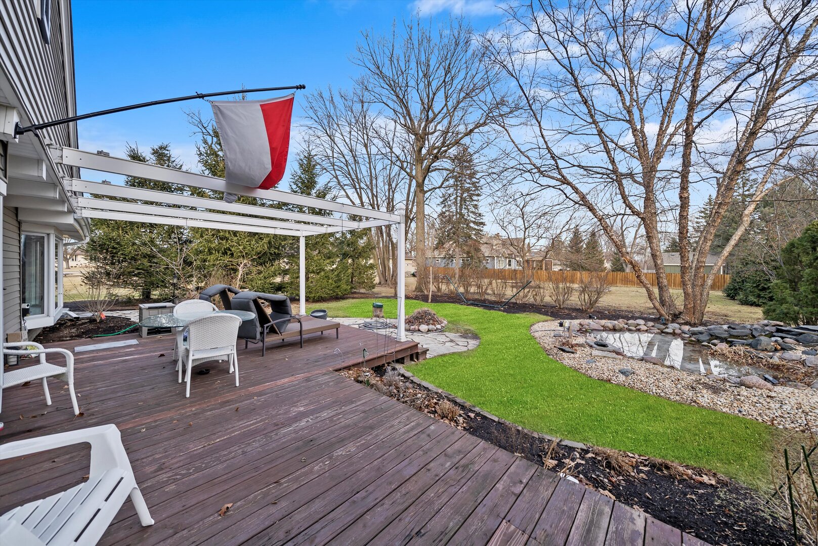 452 Deerpath Road Wood Dale, IL 60191 - Photo 39 of 50 a view of a patio with table and chairs potted plants with wooden floor and fence