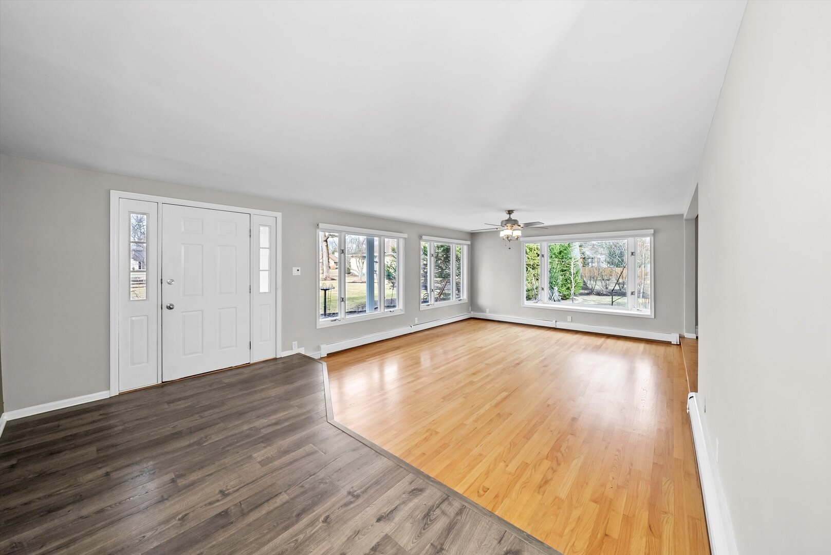 452 Deerpath Road Wood Dale, IL 60191 - Photo 4 of 50 an empty room with wooden floor and windows