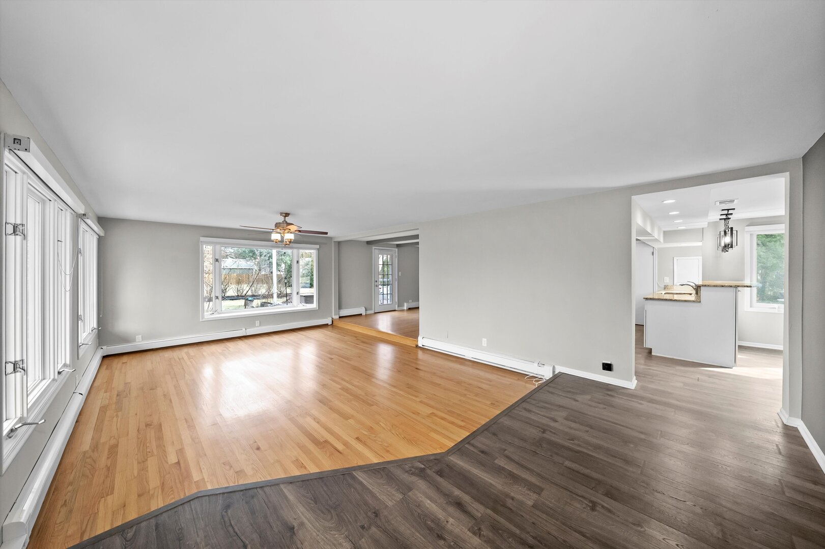 452 Deerpath Road Wood Dale, IL 60191 - Photo 6 of 50 an empty room with wooden floor and windows