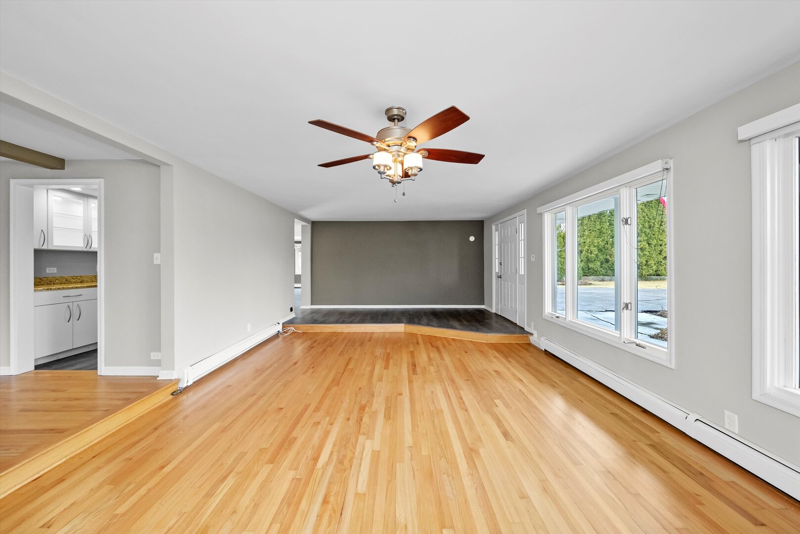 452 Deerpath Road Wood Dale, IL 60191 - Photo 8 of 50 an empty room with wooden floor and windows