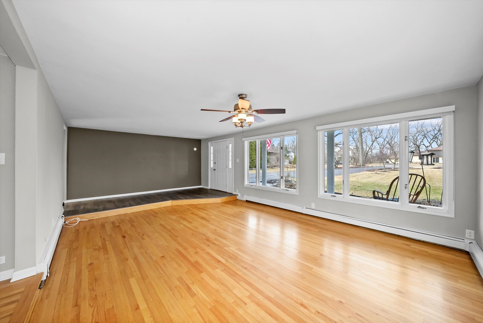 452 Deerpath Road Wood Dale, IL 60191 - Photo 9 of 50 a view of an empty room with a window and wooden floor