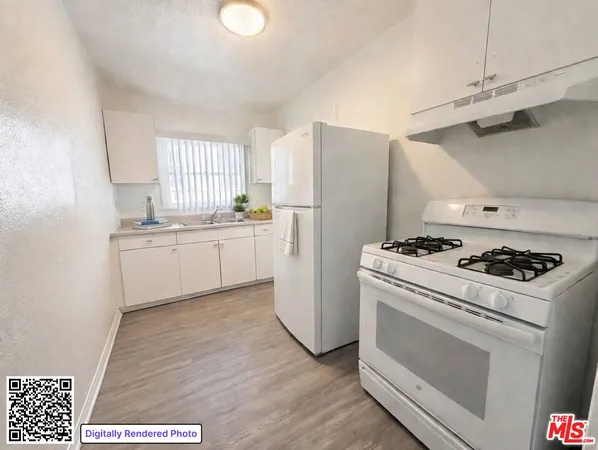 a kitchen with a stove a refrigerator and a window