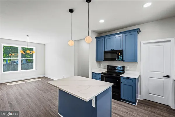 a dining room with furniture window and wooden floor