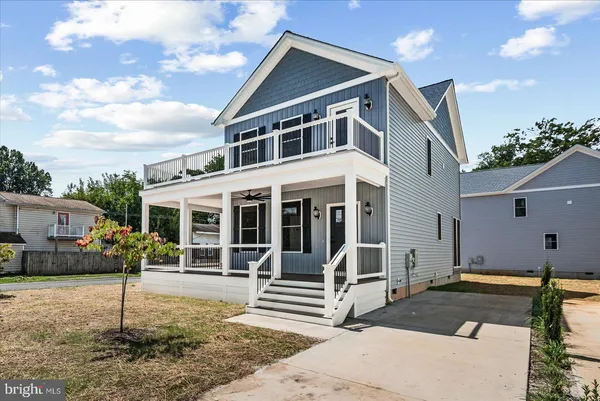 a front view of a house with a porch