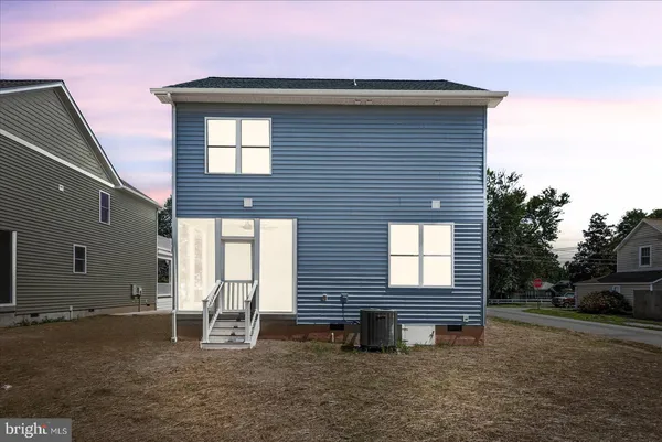an aerial view of residential house with outdoor space and street view