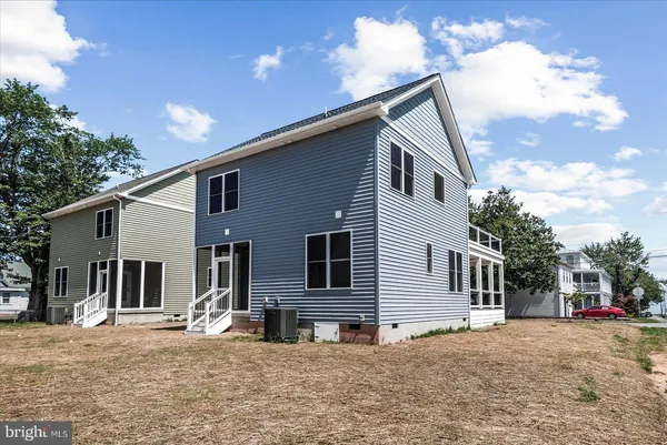 an aerial view of house with swimming pool outdoor seating and yard