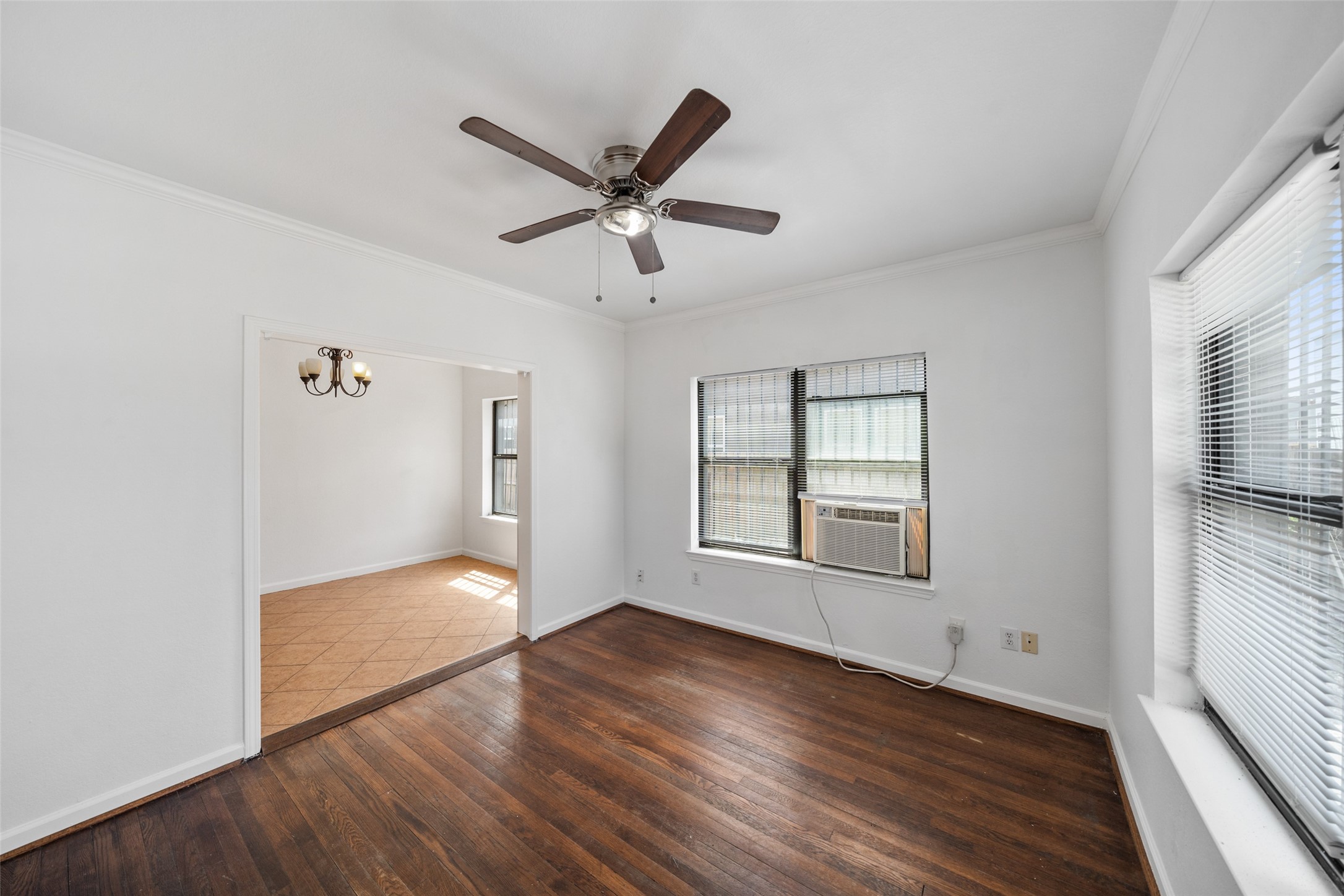 406 Quitman Street, Unit 2 Houston, TX 77009 - Photo 6 of 22 a view of empty room with wooden floor and fan