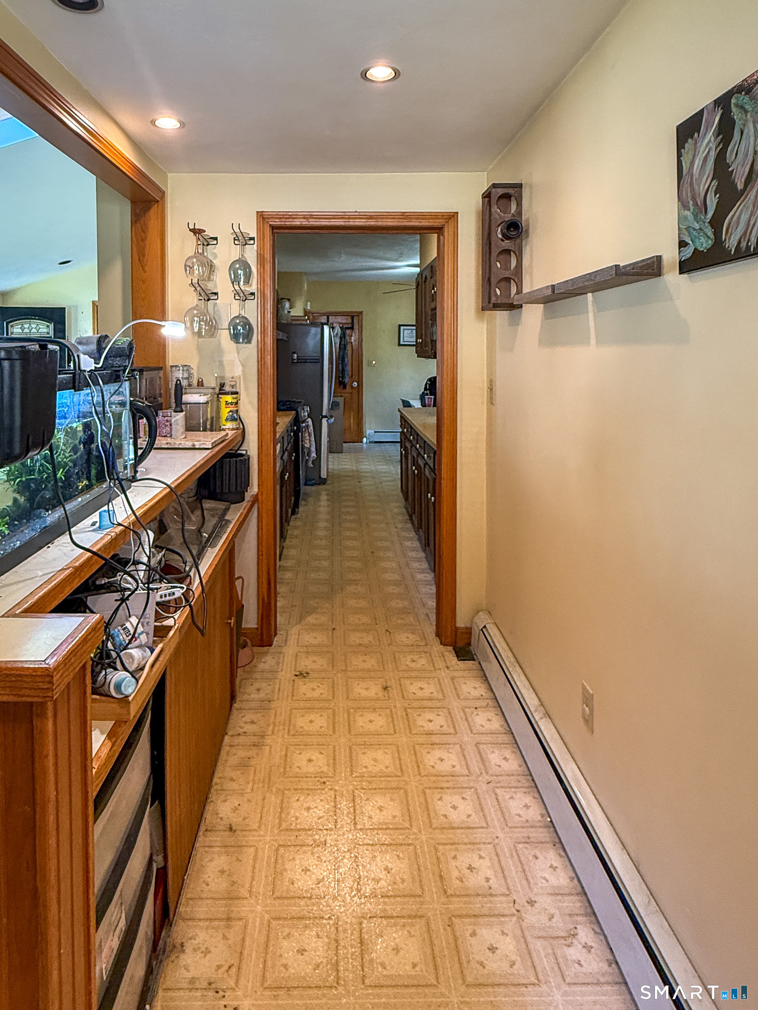 64 Hoffman Street Torrington, CT 06790 - Photo 11 of 27 a hallway with a large kitchen stove and a refrigerator