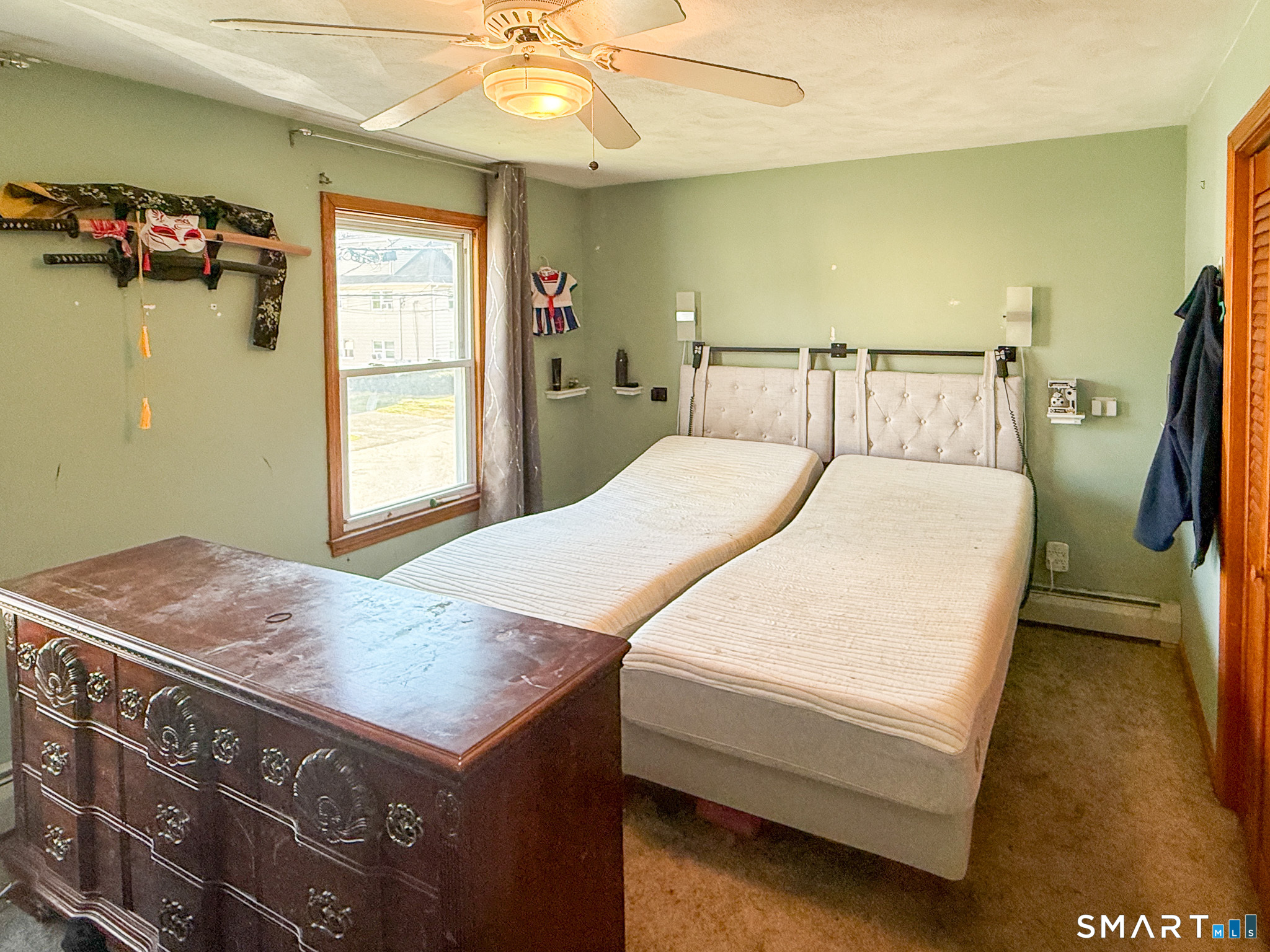 64 Hoffman Street Torrington, CT 06790 - Photo 14 of 27 a bed room with a bed and a chandelier