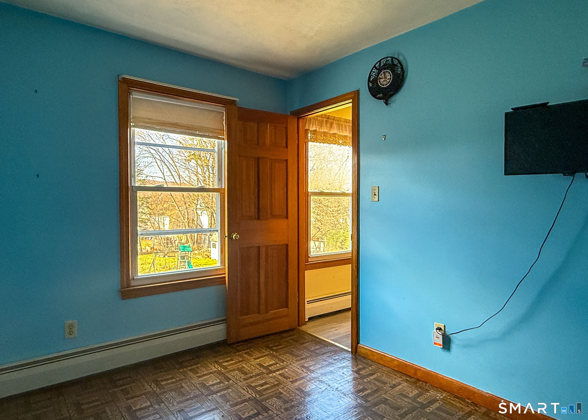 64 Hoffman Street Torrington, CT 06790 - Photo 18 of 27 a view of an empty room with wooden floor and a window