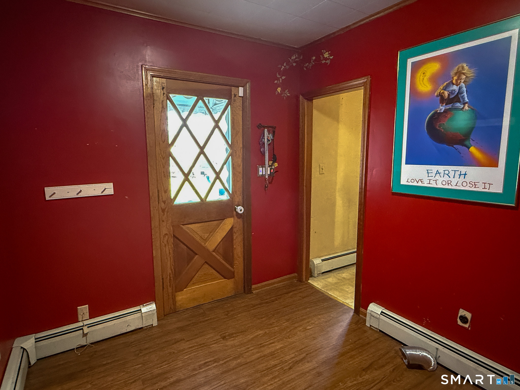 64 Hoffman Street Torrington, CT 06790 - Photo 20 of 27 a view of an empty room with a window and a bookshelf