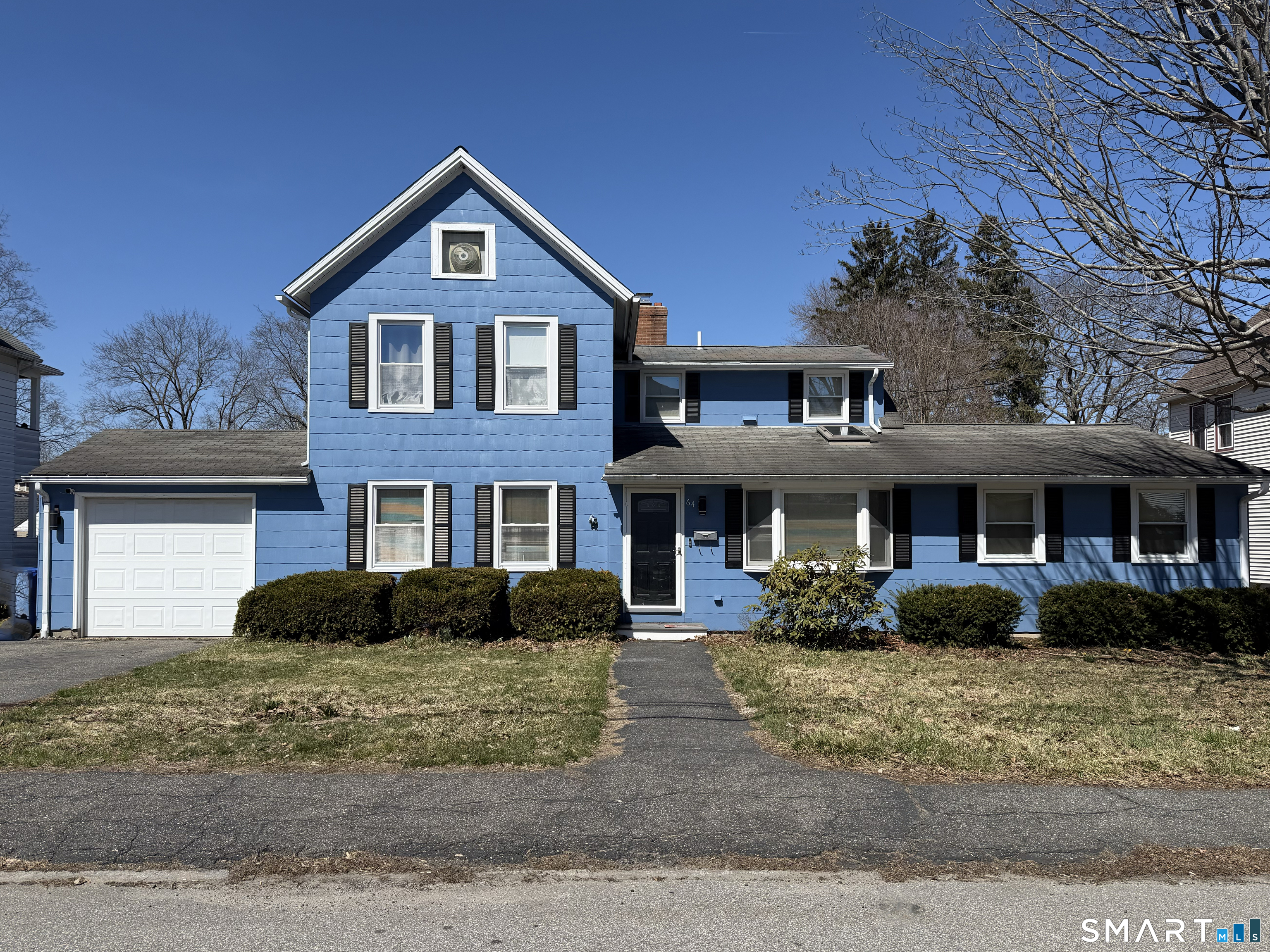 64 Hoffman Street Torrington, CT 06790 - Photo 2 of 27 a front view of a house with a yard