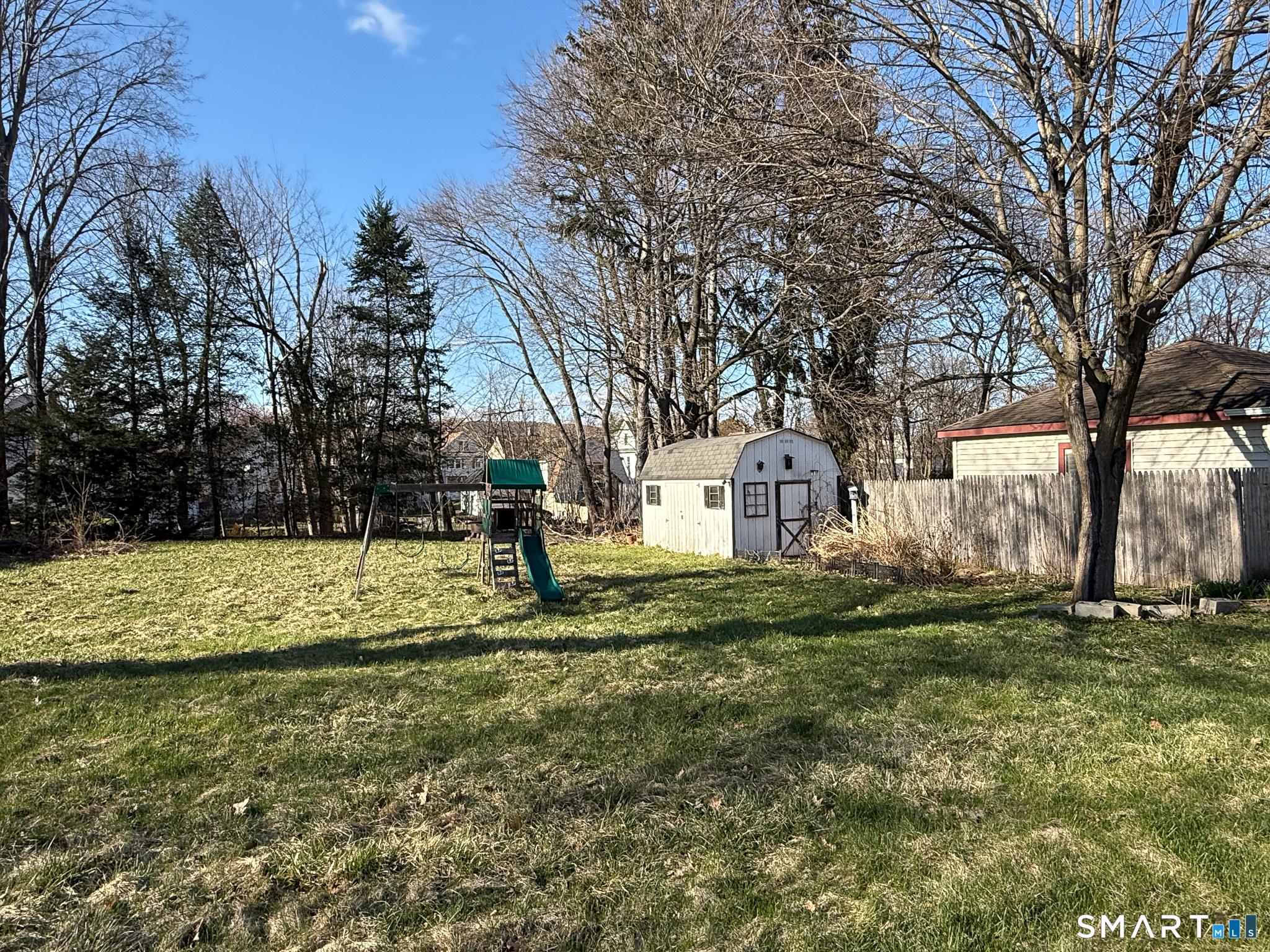 64 Hoffman Street Torrington, CT 06790 - Photo 25 of 27 a view of a yard with large trees