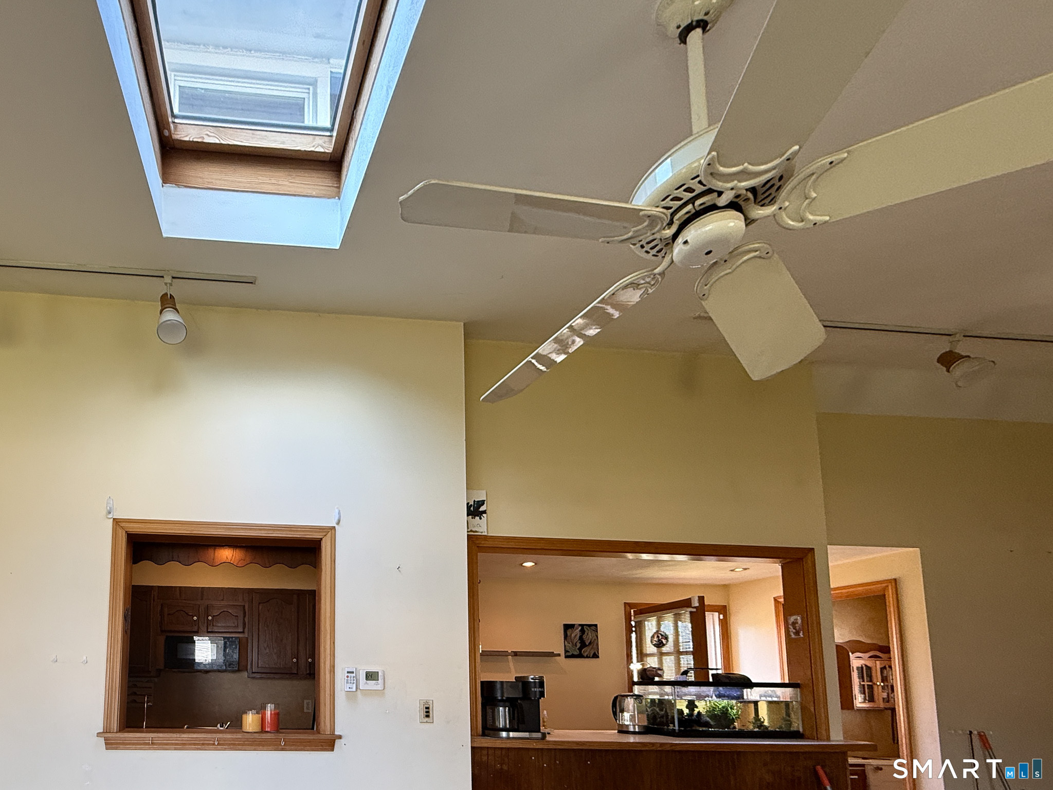64 Hoffman Street Torrington, CT 06790 - Photo 3 of 27 a view of a room with a window and a ceiling fan