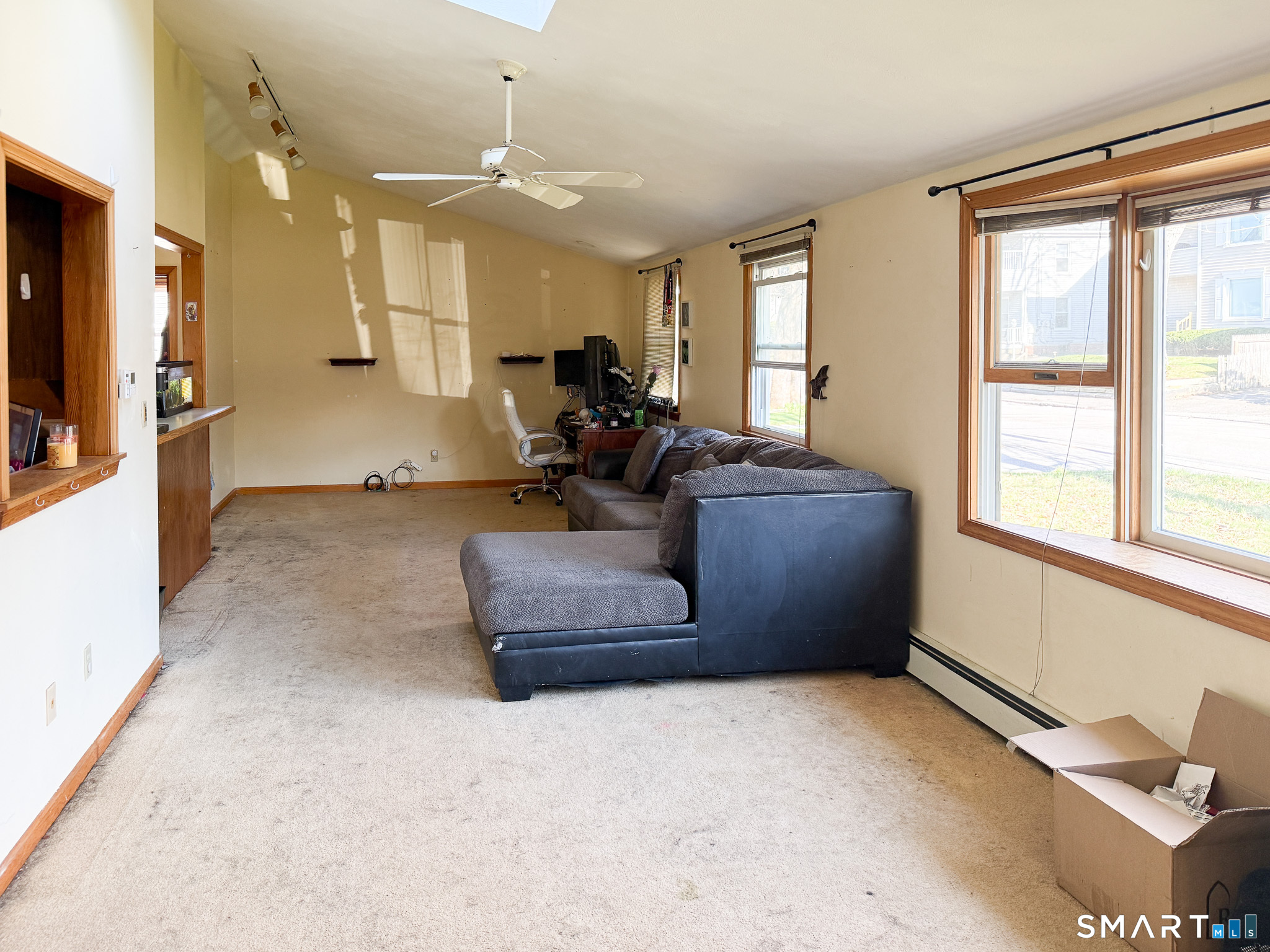 64 Hoffman Street Torrington, CT 06790 - Photo 4 of 27 a living room with furniture and a large window