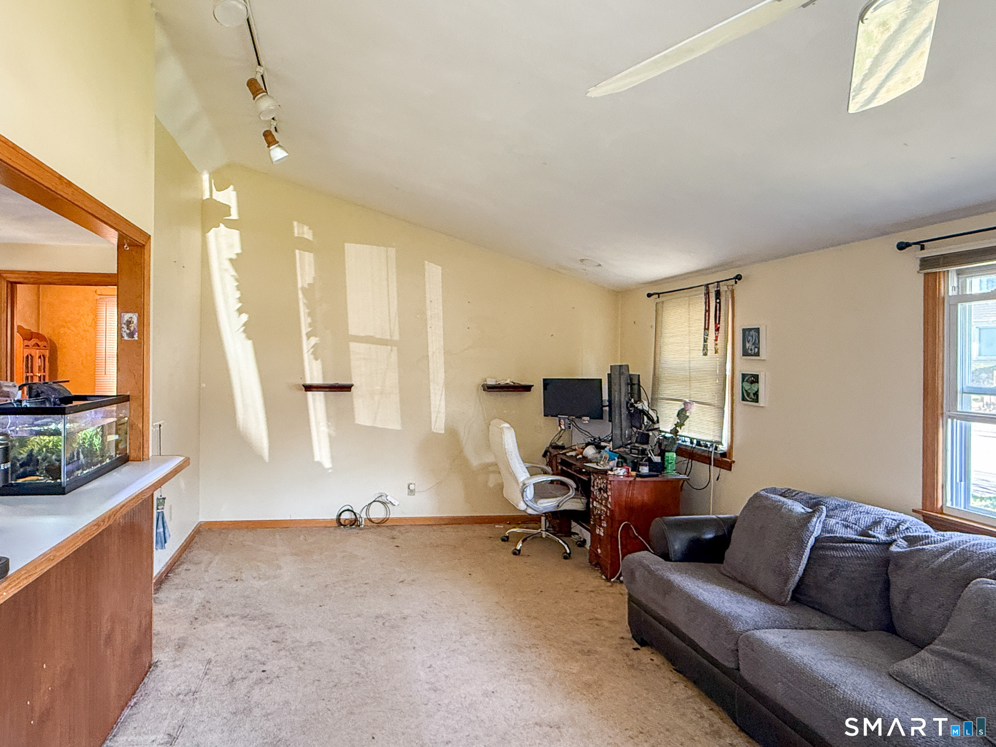 64 Hoffman Street Torrington, CT 06790 - Photo 6 of 27 a living room with furniture and a large window