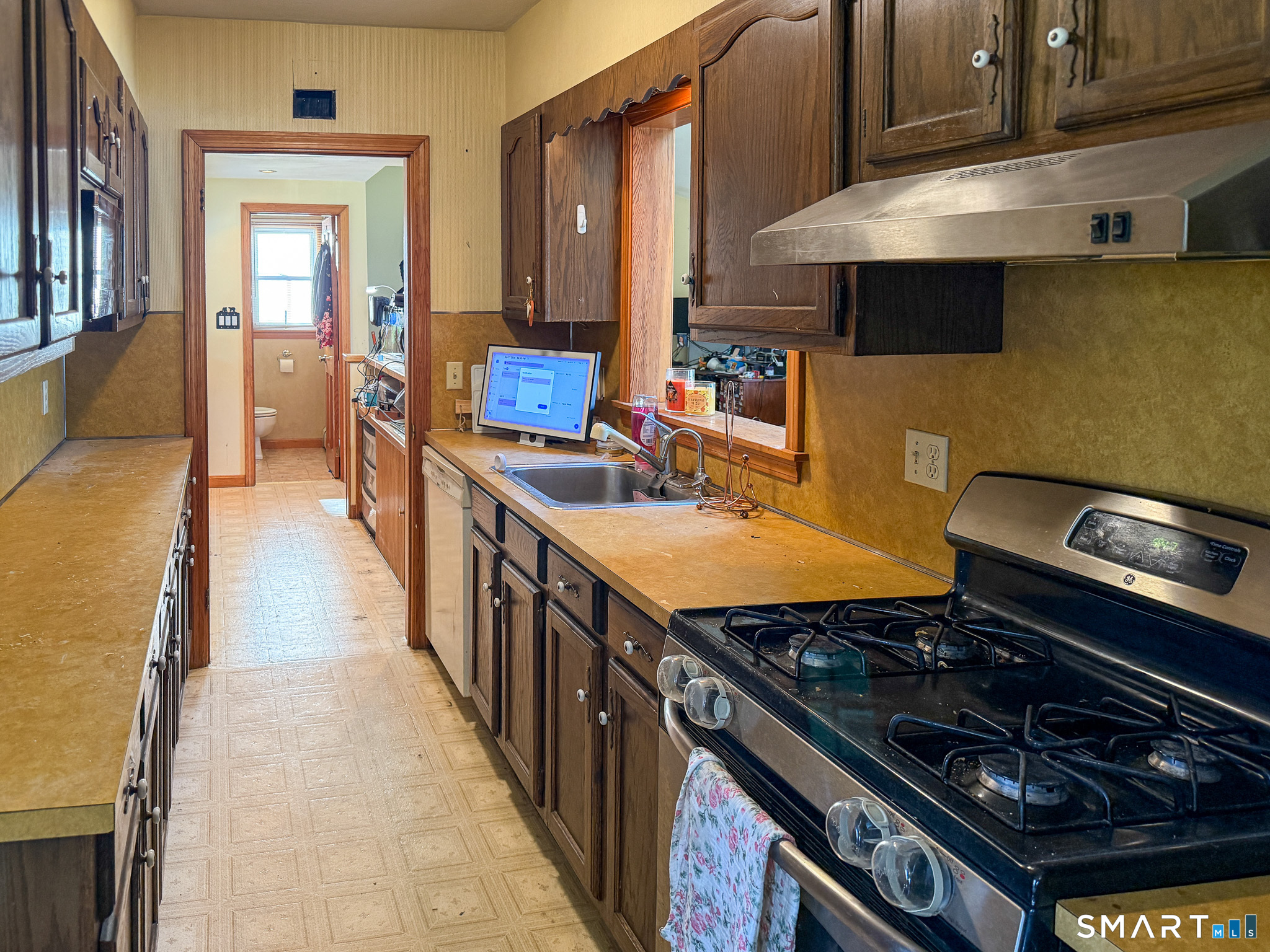 64 Hoffman Street Torrington, CT 06790 - Photo 8 of 27 a kitchen with stainless steel appliances granite countertop a stove and a sink