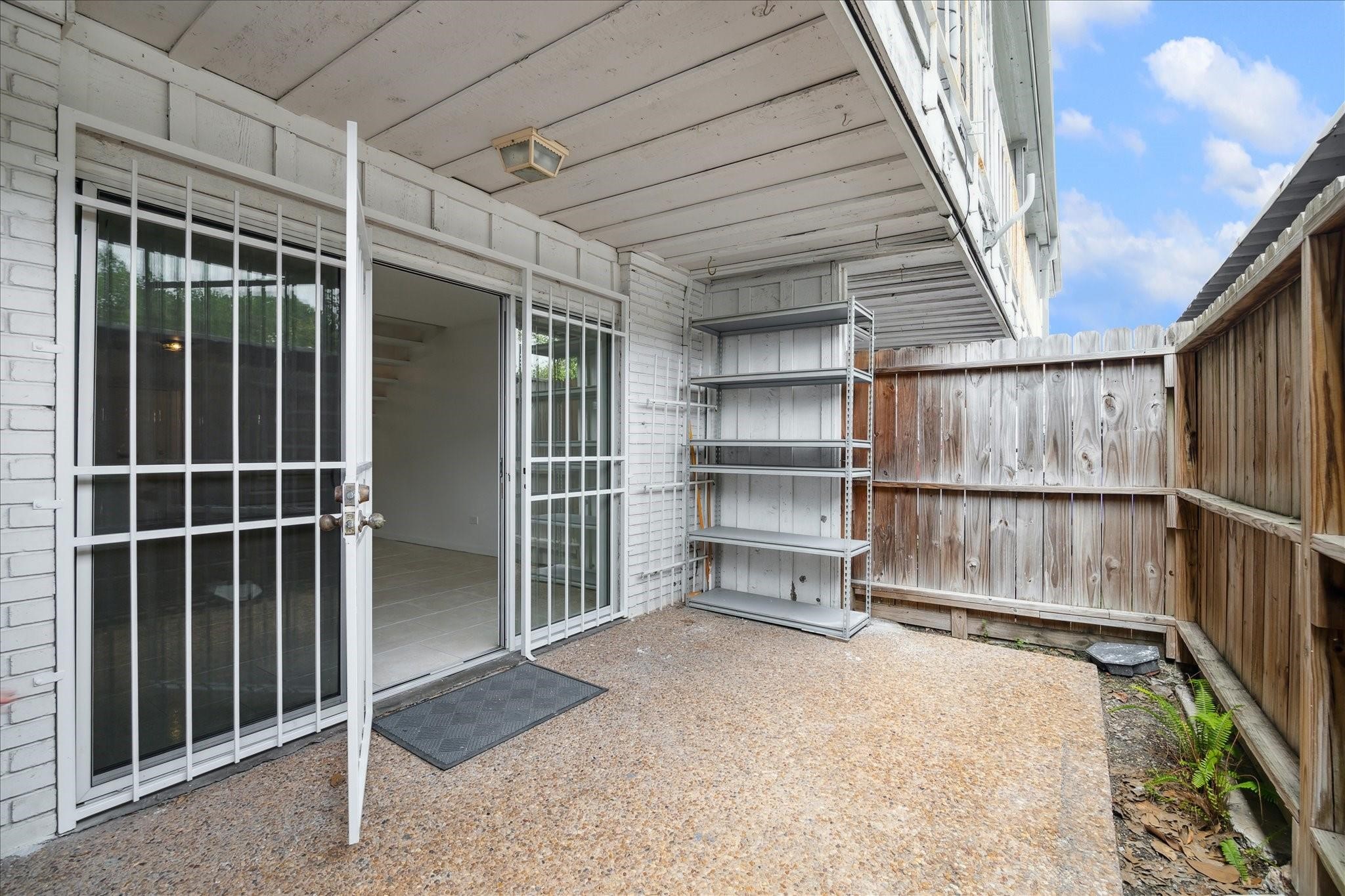 7821 Rue St Cyr Street, Unit 55 Houston, TX 77074 - Photo 12 of 16 Private fenced patio—perfect for relaxing or entertaining.