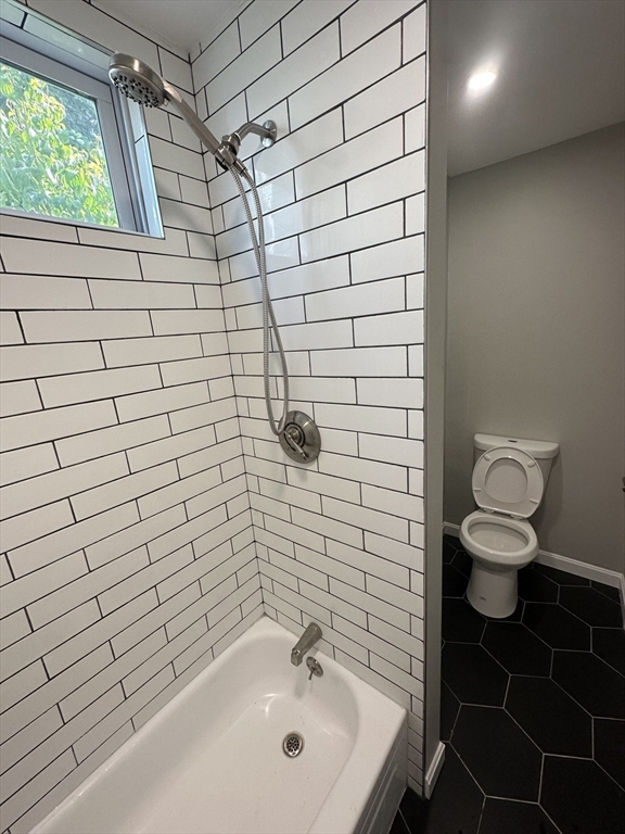 531 Revere Street, Unit 4 Revere, MA 02151 - Photo 4 of 10 a bathroom with a sink toilet and shower