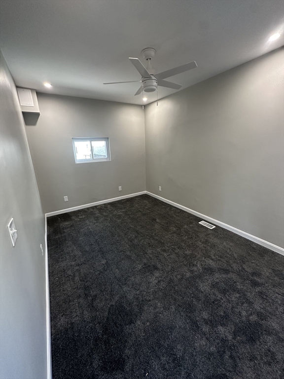 531 Revere Street, Unit 4 Revere, MA 02151 - Photo 7 of 10 an empty room with windows and fireplace