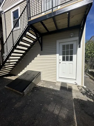 a view of house with backyard