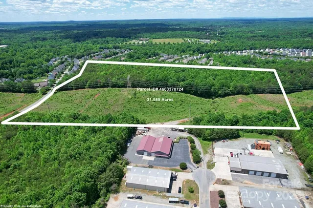 a view of yard with outdoor swimming pool and green space