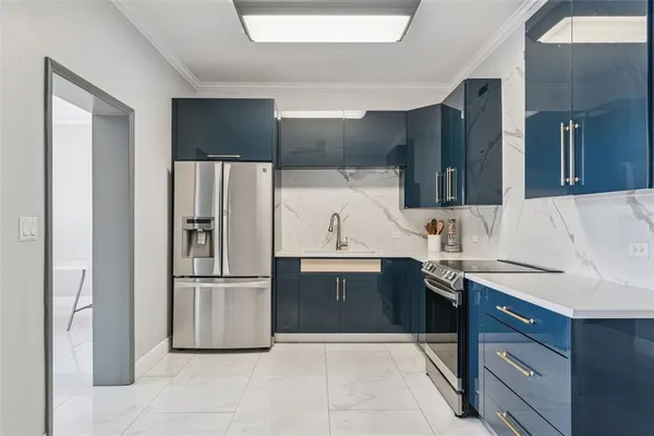 a kitchen with stainless steel appliances granite countertop a refrigerator and a sink