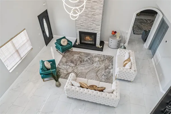 a living room with furniture and a fireplace
