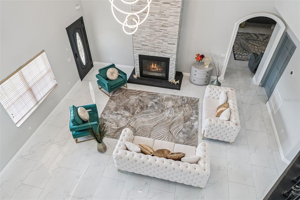 6053 New Hope Road Orlando, FL 32824 - Photo 13 of 40 a living room with furniture and a fireplace