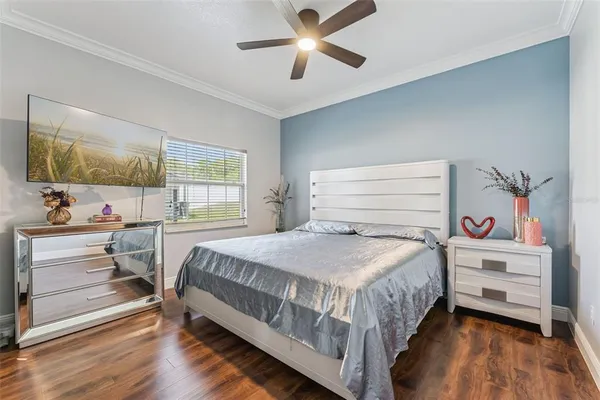 a bedroom with a bed and a dresser