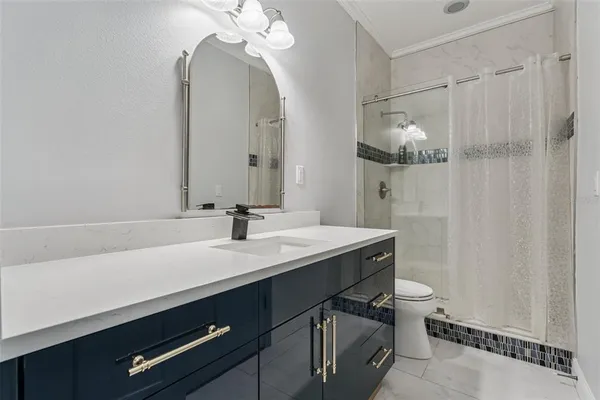 a bathroom with a sink a vanity and a mirror