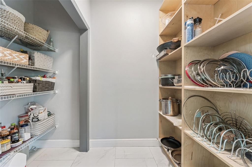 6053 New Hope Road Orlando, FL 32824 - Photo 25 of 40 a view of walk in closet with clothes and shoes