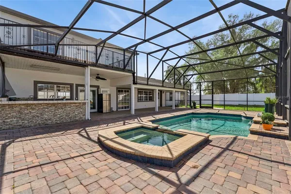 a view of a house with backyard and porch