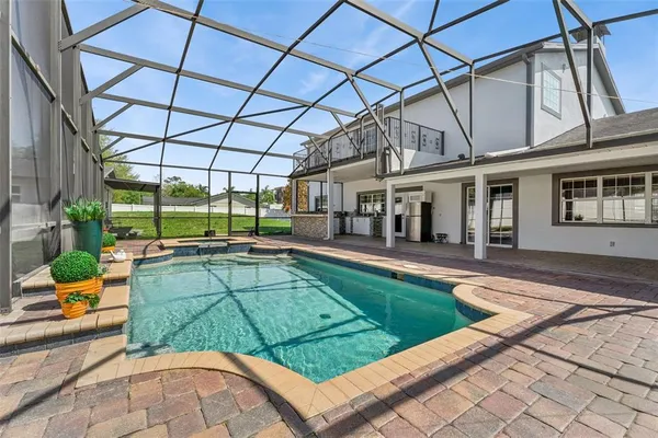 a view of a swimming pool with a patio