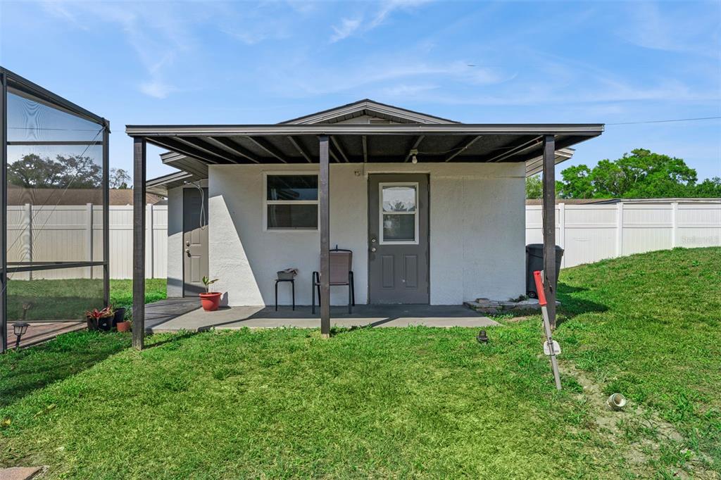 6053 New Hope Road Orlando, FL 32824 - Photo 32 of 40 a front view of a house with garden