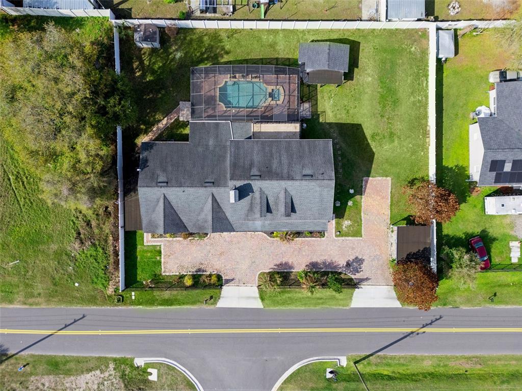 6053 New Hope Road Orlando, FL 32824 - Photo 37 of 40 an aerial view of a house with a garden and yard