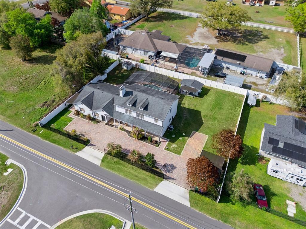 6053 New Hope Road Orlando, FL 32824 - Photo 39 of 40 an aerial view of a house with garden space and street view