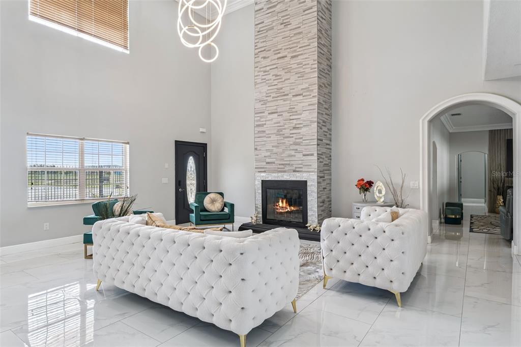 6053 New Hope Road Orlando, FL 32824 - Photo 4 of 40 a living room with furniture and a fireplace