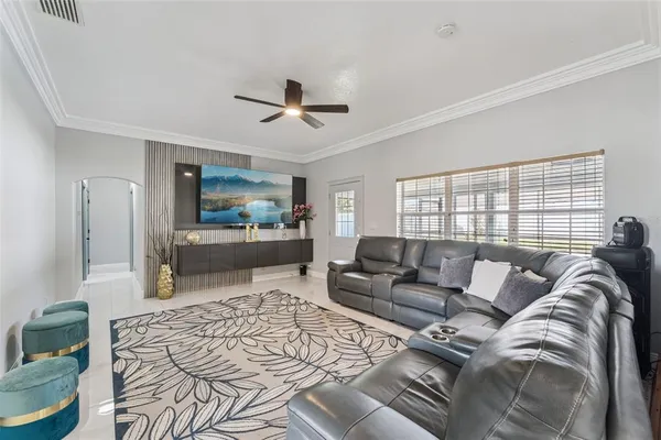 a living room with furniture and a flat screen tv