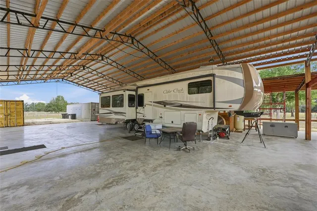a view of a porch with furniture and a garage