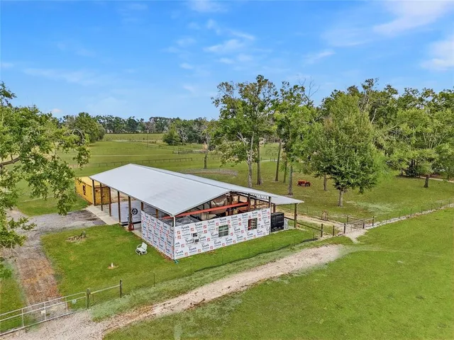 an aerial view of a house having yard