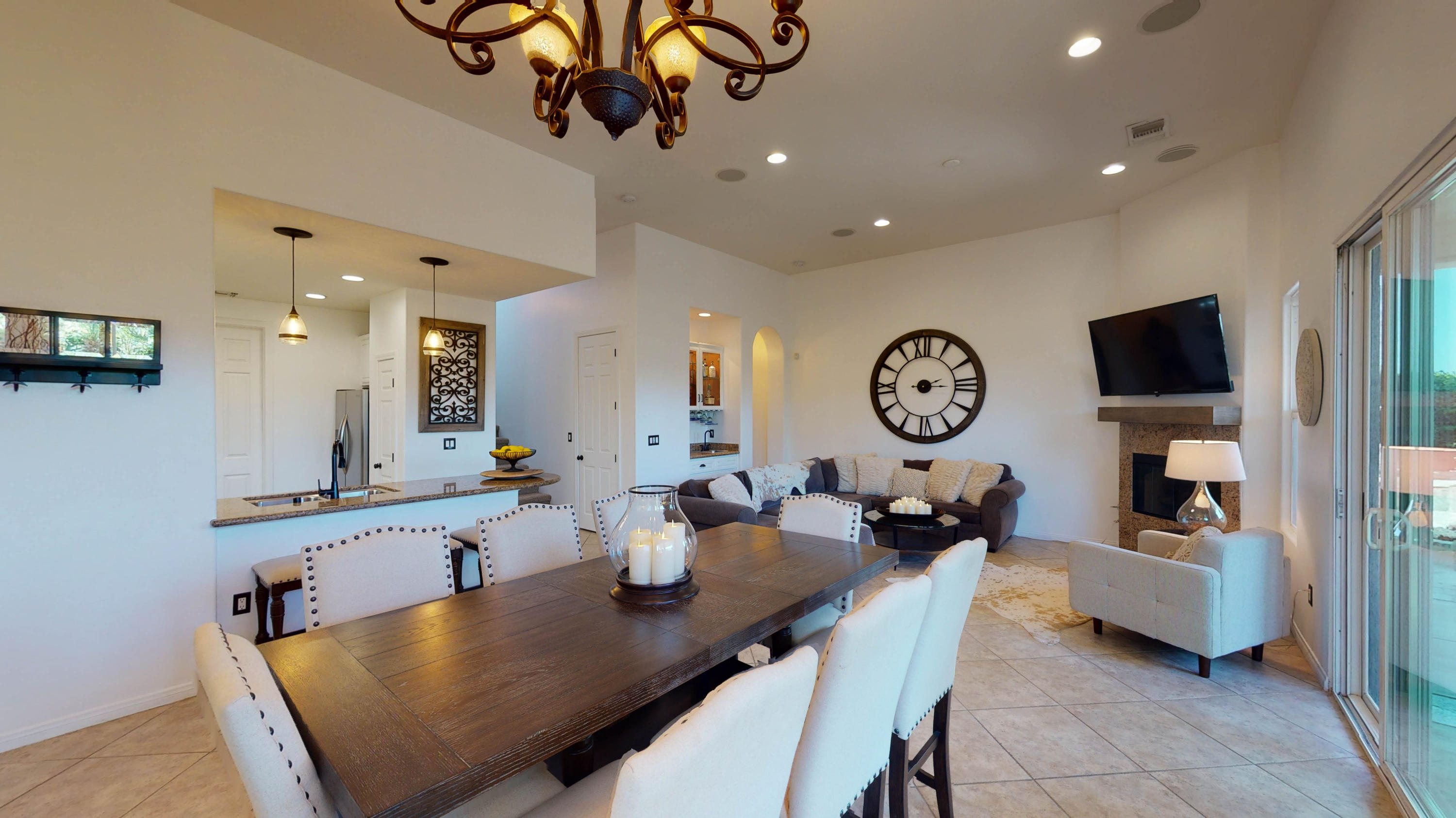 a very nice looking dining room with a table chairs and a chandelier